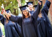 12197771-happy-group-of-students-with-arms-up-at-their-graduation